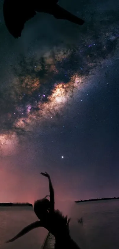 Silhouette under a starry sky with the Milky Way visible.