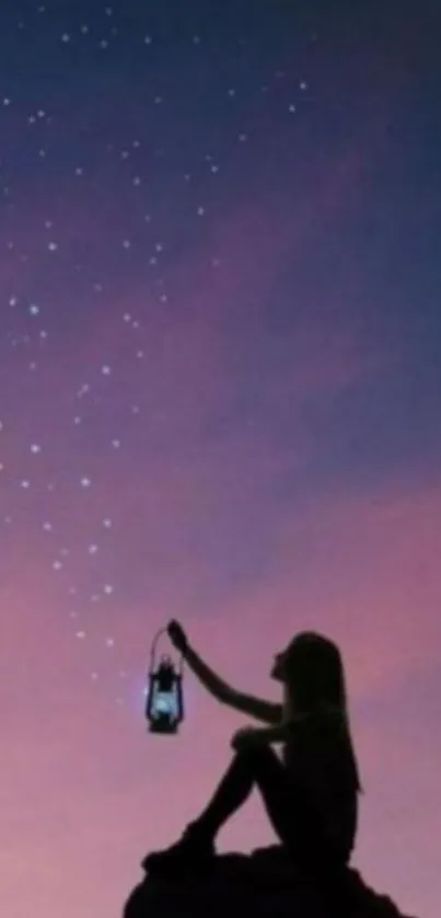 Silhouette with lantern under starry night sky wallpaper.