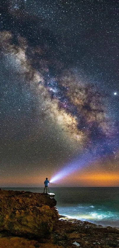 A lone adventurer beneath a starry night sky over the ocean, featuring the Milky Way.