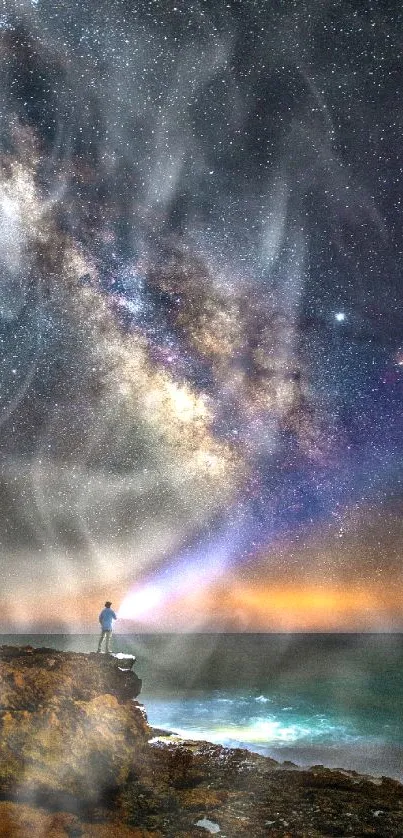 Person gazing at the Milky Way under starry night sky over the ocean.