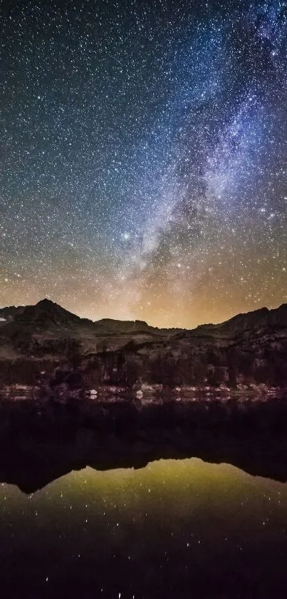 Starry night sky reflecting on a calm lake with silhouette of mountains.