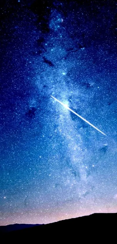 A serene starry night sky with a bright shooting star in a blue cosmic setting.