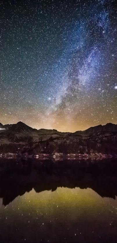 Starry night sky reflecting over mountains and a calm lake.