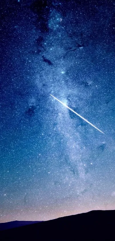 A starry night sky with a shooting star across a dark blue background.