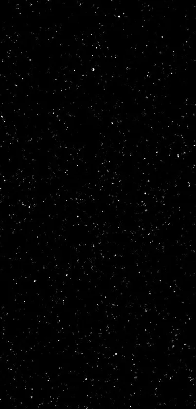 Starry night sky with countless tiny stars shimmer on a dark black background.