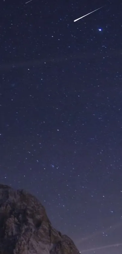 Starry night sky with meteor in dark blue wallpaper.