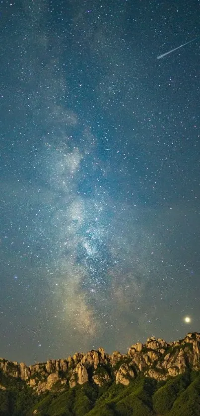 Starry night sky over mountains with shooting star.