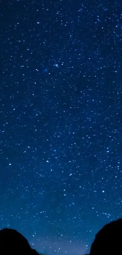 Mobile wallpaper of a star-filled night sky in deep blue hues.