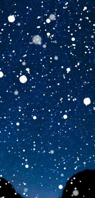 Starry night sky with snowflakes falling on a deep blue background.