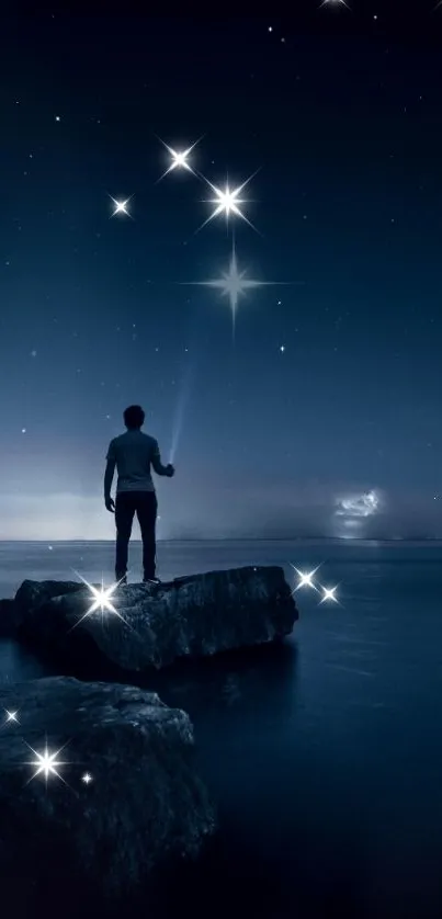 Man standing on rocks gazing at a starry night sky, surrounded by shimmering stars.