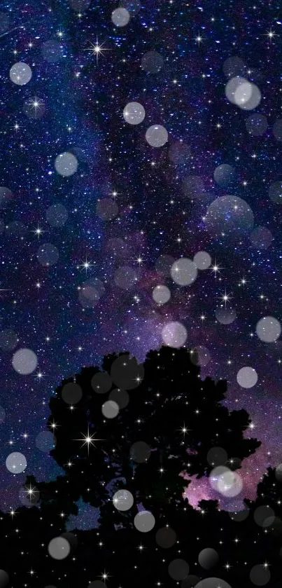 Starry night sky with tree silhouette and galaxy.