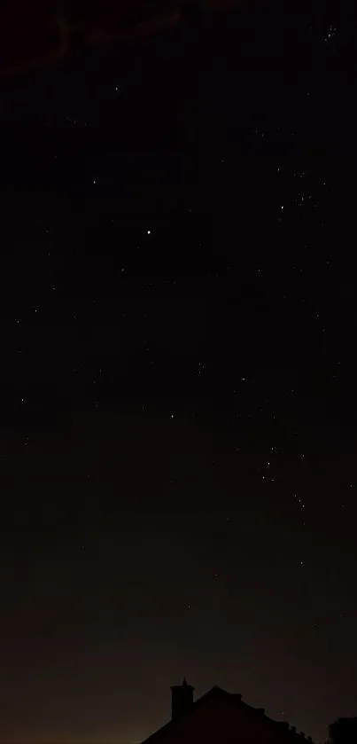 Silhouette of rooftops under a starry night sky wallpaper.