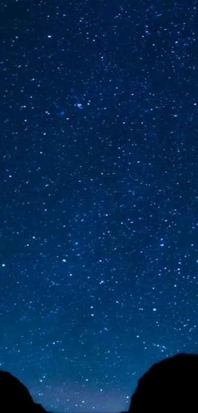 A serene night sky filled with countless twinkling stars on a deep blue background.