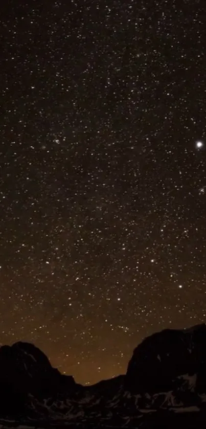 Starry night sky over mountains, perfect for phone wallpaper.