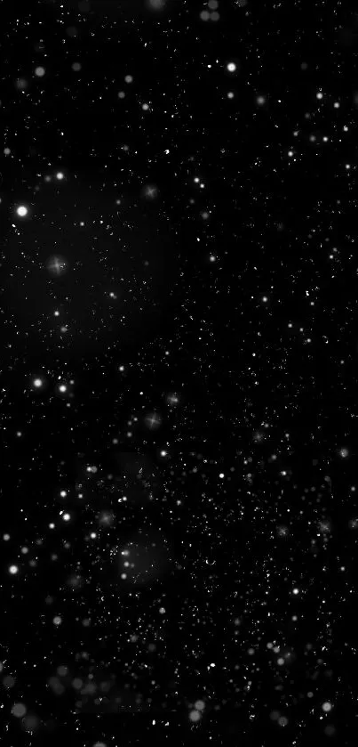 Starry black sky wallpaper for mobile devices.