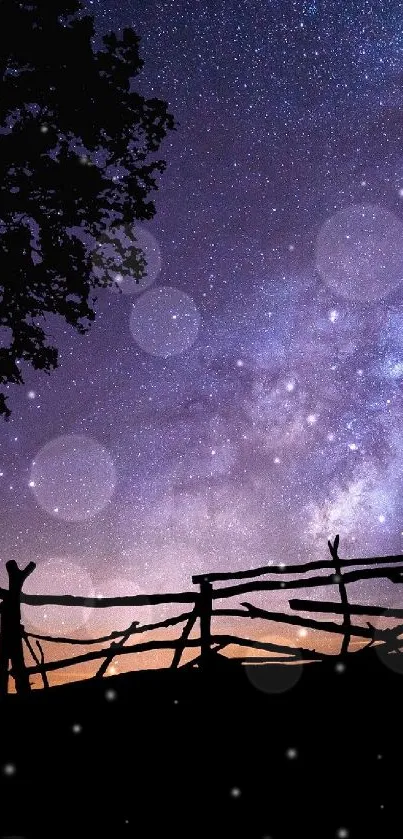 Silhouette of a swing against a vibrant starry night sky with a tree.