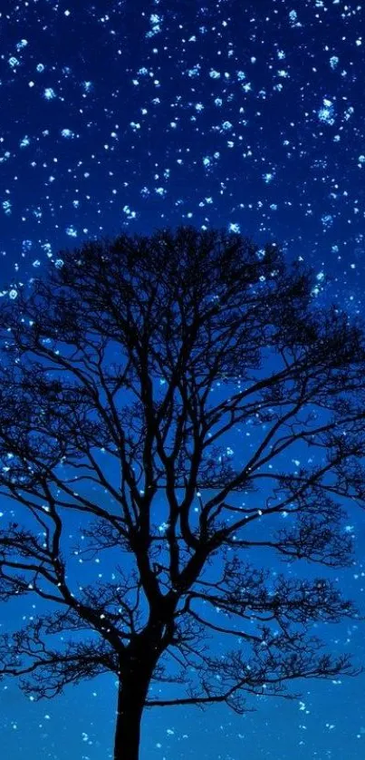 Silhouette of a tree against a starry night sky on a mobile wallpaper.