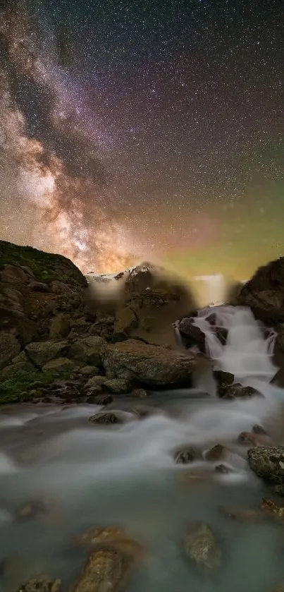 Waterfall under a starry night sky with a vibrant galaxy in view.