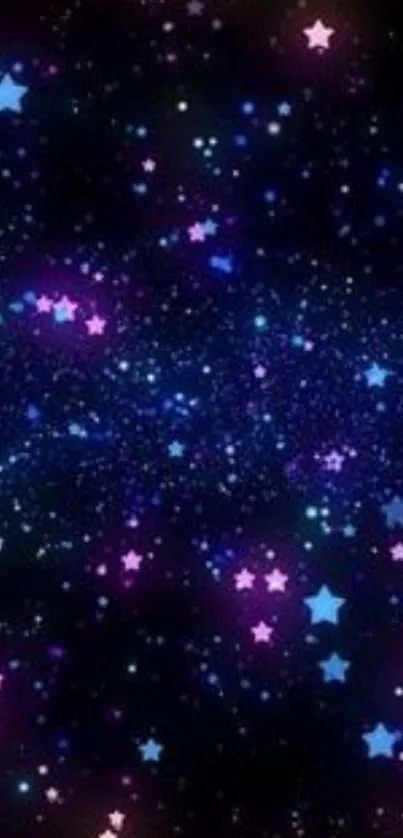 Starry sky with blue and pink stars against a black background.