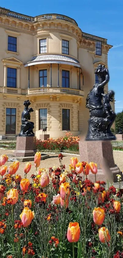 Stately home with vibrant flower garden and sculptures.