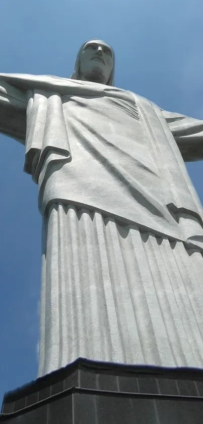 Christ the Redeemer statue with a blue sky backdrop.