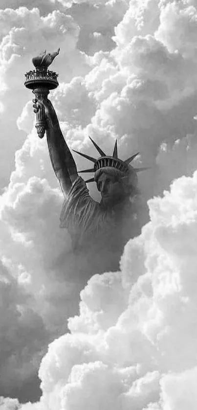 Monochrome wallpaper of the Statue of Liberty amid clouds.