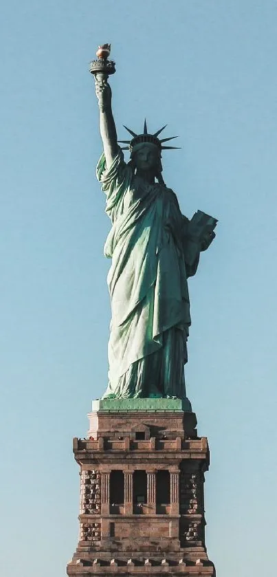 Statue of Liberty under clear blue sky.