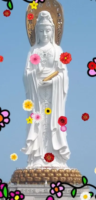 Statue surrounded by colorful flowers on a sky blue background.