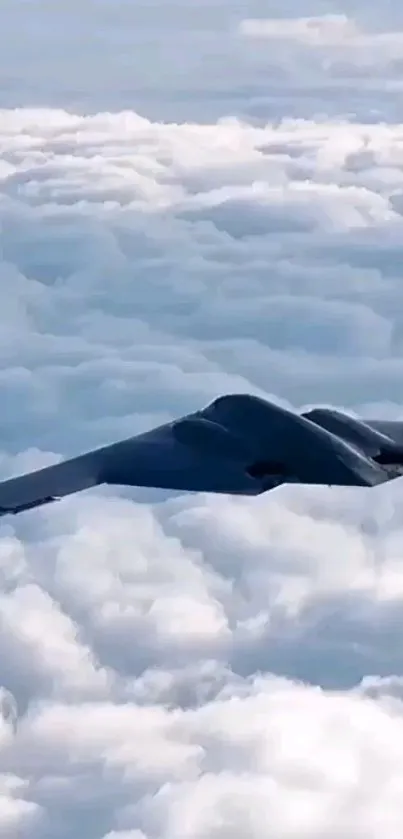 Stealth bomber flying above fluffy clouds.