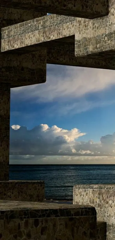 Stone arch framing ocean view with cloudy sky.