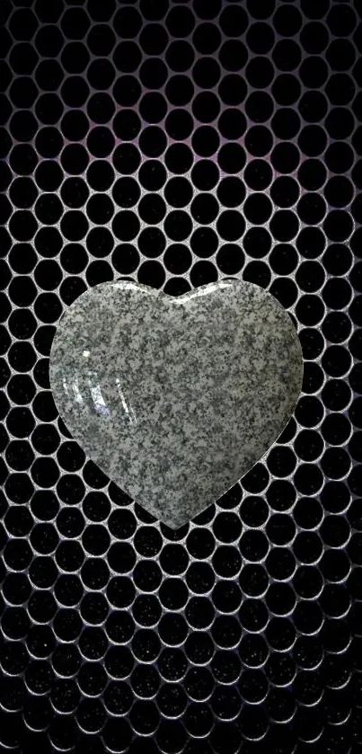 Textured stone heart on a hexagon pattern background.