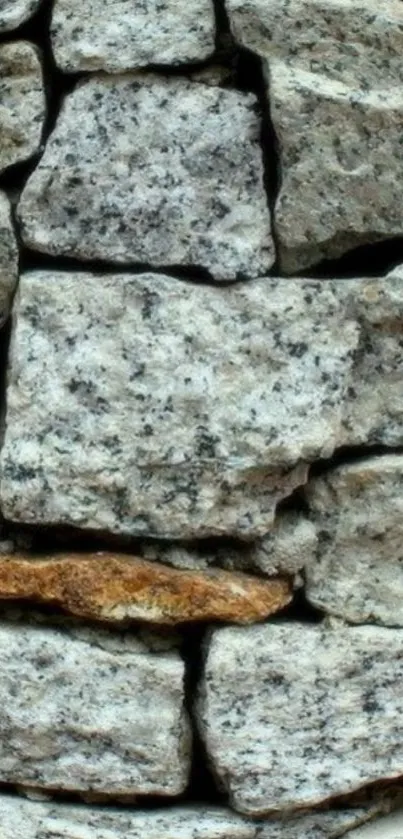 Close-up of rustic stone wall texture wallpaper.