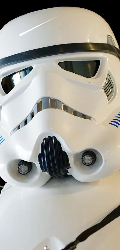 Close-up of iconic Stormtrooper helmet on mobile wallpaper.