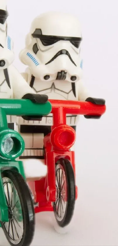 Stormtrooper figurines on red and green bicycles in a playful setup.