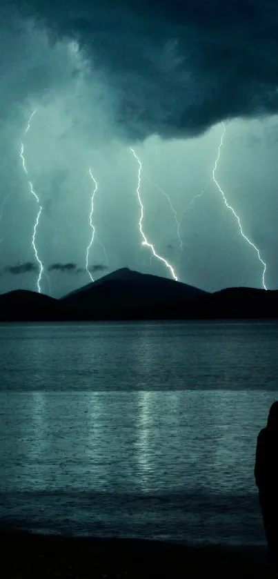 Lightning storm over a lake with silhouette view.