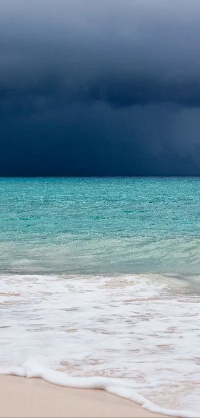 Tranquil beach scene with approaching storm over teal ocean.