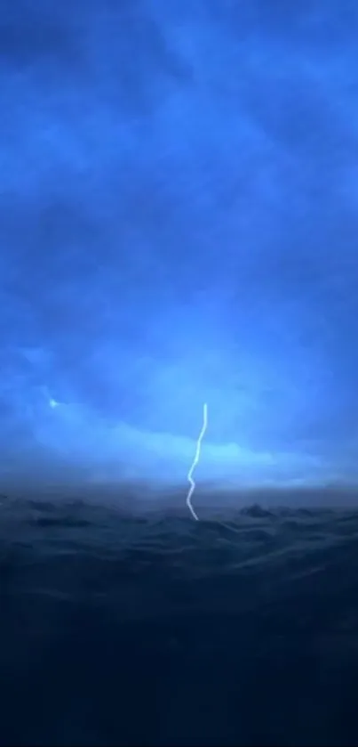 Dramatic ocean scene with lightning under a blue sky.