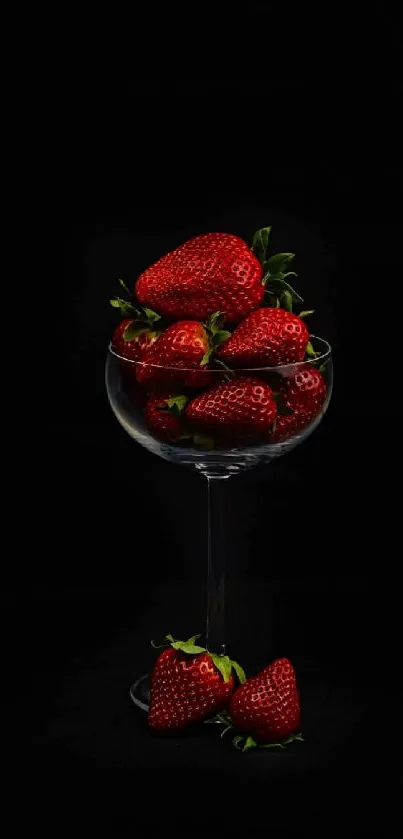 Elegant strawberries in glass with dark background wallpaper.