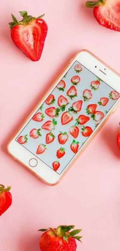 Mobile wallpaper with strawberry pattern and pink background.