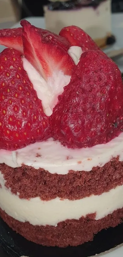 Red velvet cake with strawberries on top.