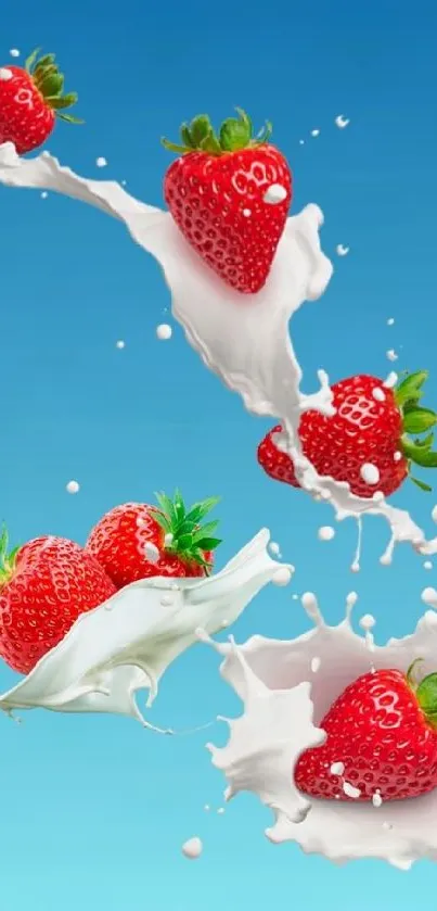 Fresh strawberries splash with milk on a blue gradient background.