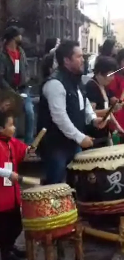 Traditional drummers performing at a lively street festival.