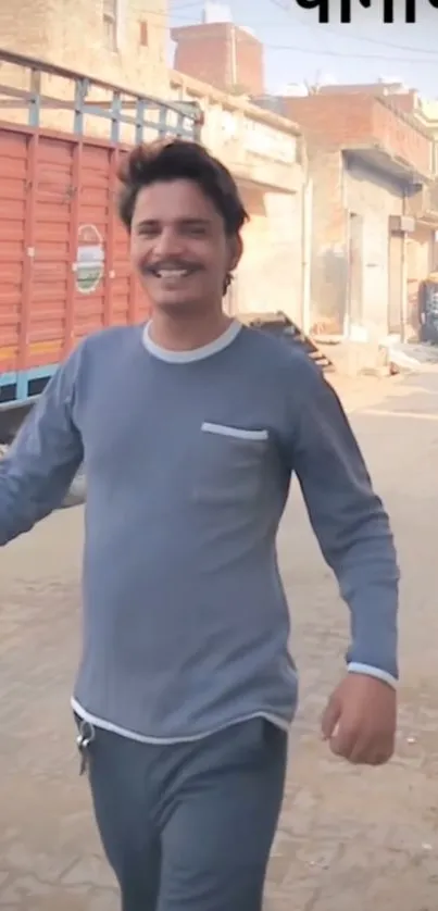 Man smiling while walking on a street.