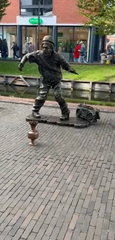 Dynamic street performer sculpture by the canal.