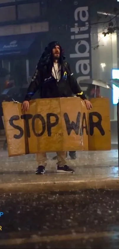 Protester holding 'Stop the War' sign in rainy street.