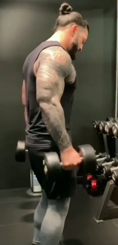 Man lifting dumbbells in a gym setting, showcasing strength and focus.