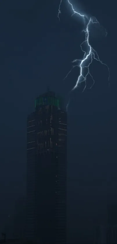 A lightning bolt illuminates a dark city skyline at night.