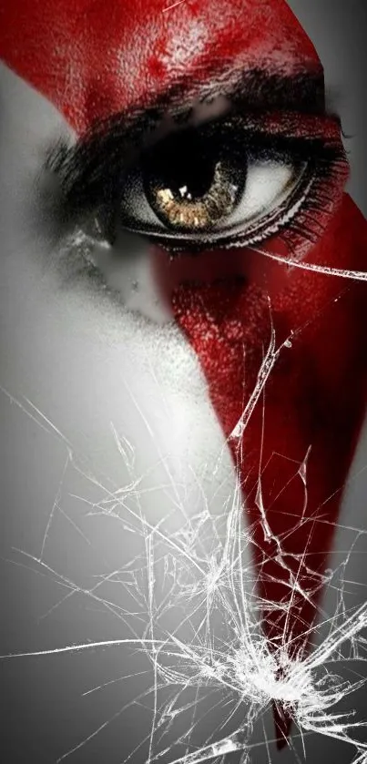 Eye with bold red paint and shattered glass effect.