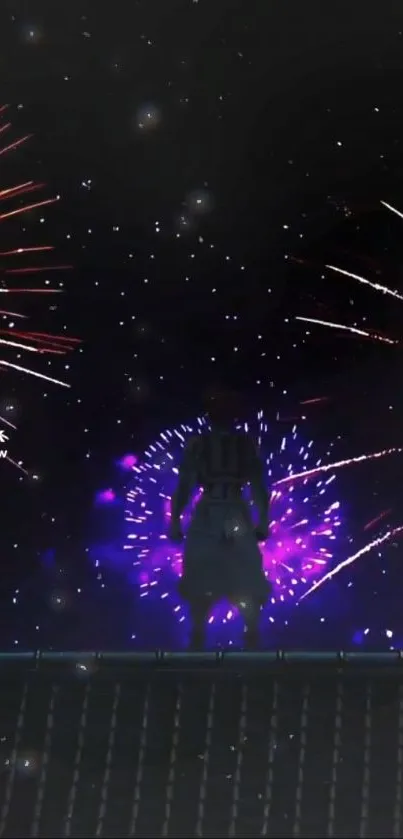 Silhouette with vibrant fireworks in the night sky.