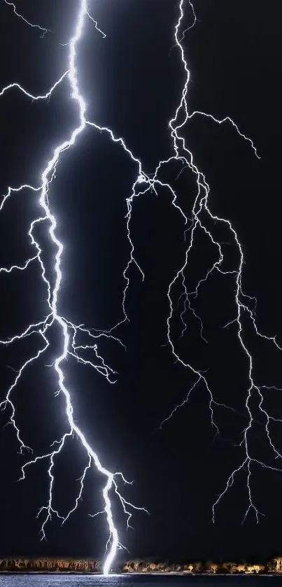 Dramatic lightning strike on dark night sky wallpaper.